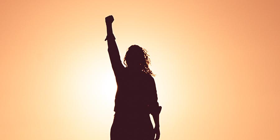 Woman with Fist in the Air with Confidence