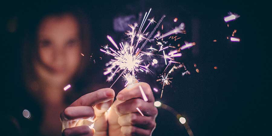 Woman holding sparklers